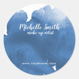 Abstrakt vattenfärgsblått penseldrag färg stänk runt klistermärke