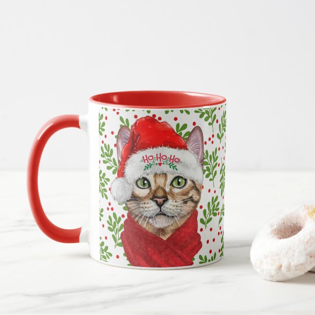 Abyssinian Cat in a Santa Hat med Holly-jul Mugg (Med munk)