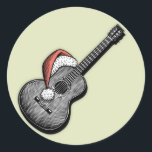 Acoustic Claus Runt Klistermärke<br><div class="desc">En klassisk gitarr som bär en Jultomten hatt. Svart och vit med röd (hatt) vriden penna och bläck teckning,  ser ut som ett träsnitt,  på t-shirts,  kort och presenter.</div>