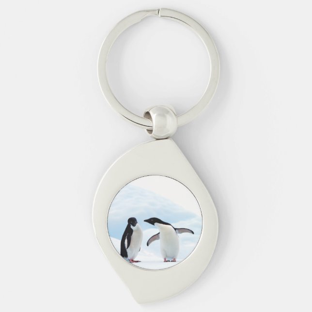 Adelie Penguins Swirl Silverfärgad Nyckelring (Framsidan)