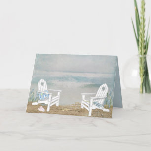 Adirondack-strandstolar på sand kort