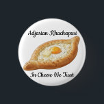 Adjarian Khachapuri  Knapp<br><div class="desc">Adjarian Khachapuri is a traditional Georgian dish from the region of Adjara, located along the Black Sea coast of Georgia. It is a boat-shaped bread made from soft yeast dough, filled with melted cheese, and topped with a fresh egg yolk and a slice of butter. Before eating, the egg and...</div>
