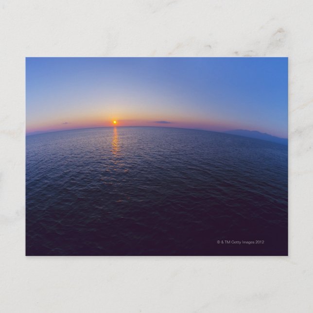 Aereriets syn på horisonten över havet vid soluppg vykort (Framsida)