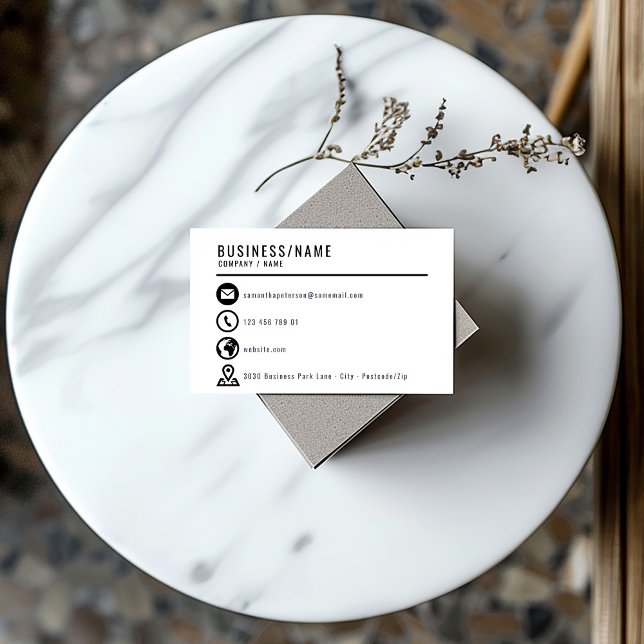 Affärskortet Svartvitt Visitkort (Minimalist black and white business card with bold contact icons and modern layout.)
