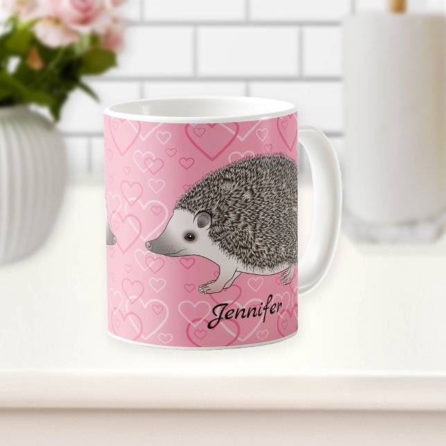 Afrikansk pygméigelkott på rosa hjärtmönster kaffemugg (Skapare uppladdad)