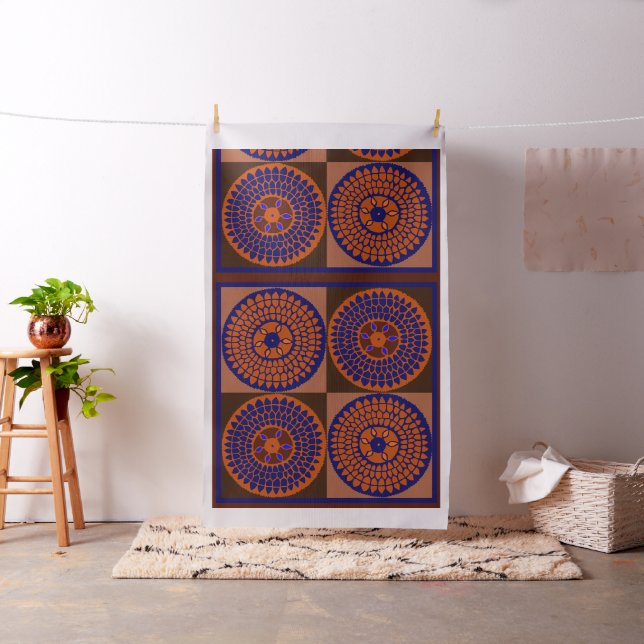 Afrikansk solros tygdesign i orange och marinblå tyg (In Situ)
