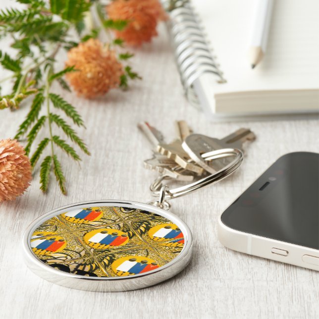 Afrikanska traditionella motivfärger tryckdesign rund silverfärgad nyckelring (Sidan)