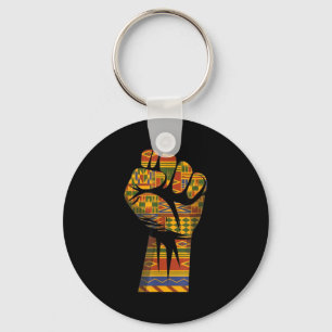 Afrikanskt kente-mönster höjd näve svart makt nyckelring