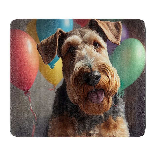 Airedale hund med tårta och ballonger (Framsidan)