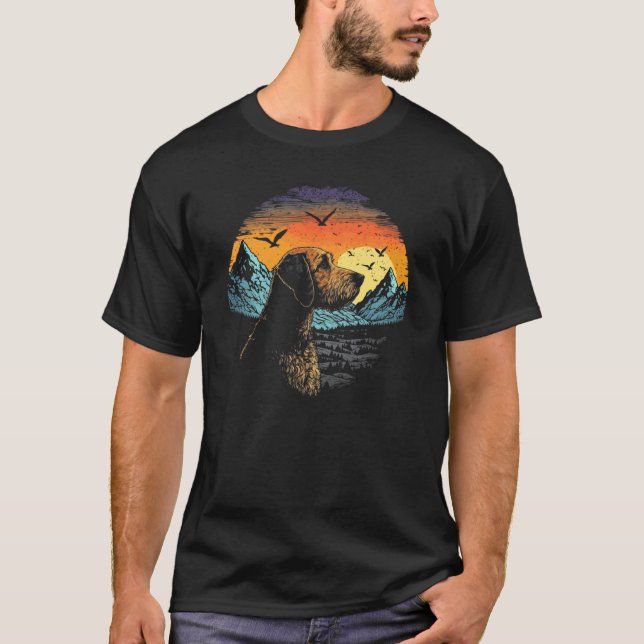 Airedale Terrier Dog and Sun Rising Over Mountains T Shirt (Framsida)