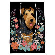 Airedale Terrier-Hund i Blomsterträdgård Cute