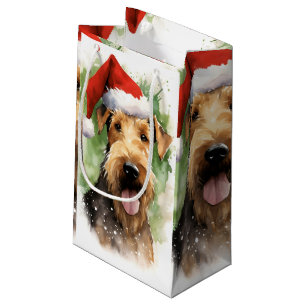 Airedale Terrier-julpenseln målar teckningar