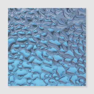 Äkta regndroppar på blått glas