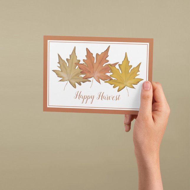 Akvarell Höst Löv Glad Skörd Helgkort (Autumn greeting card featuring watercolor maple leaves and a warm Happy Harvest message.)