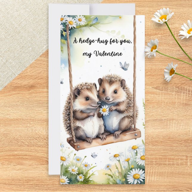 Akvarell Söta Igelkottar på Gunga Alla Hjärtans Da Julkort (A Valentine's card featuring two cute hedgehogs on a swing in a watercolor style)