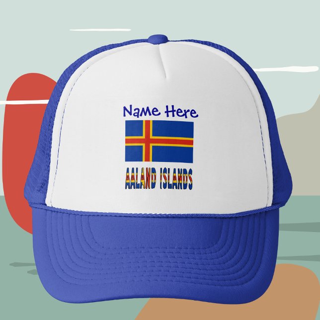 Ålander Flagga Blue Personalization Keps (Personalized trucker hat with the Ålander flag and the words AALAND ISLANDS below.)