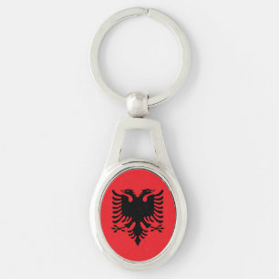 Albanska flaggan ovalt silverfärgad nyckelring