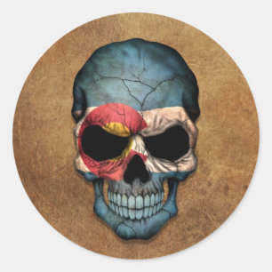 Åldras och Worn Colorado Flagga Skull Runt Klistermärke