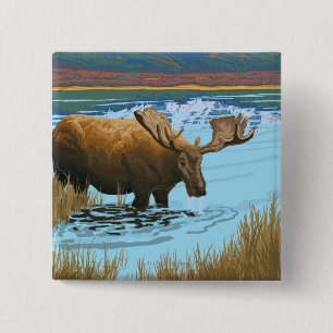 Älg som dricker på sjön - glaciärnationalpark, knapp