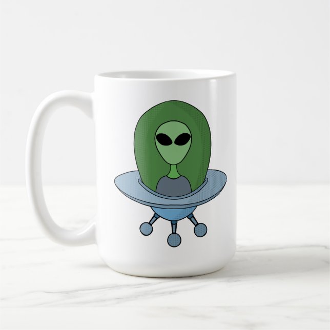 Alien i sitt lilla rymdskepp kaffemugg (Vänster)