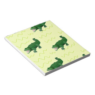 Alligator på gult anteckningsblock
