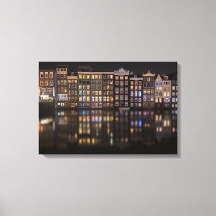 Amsterdam hus med färgrikt ljus i natten canvastryck