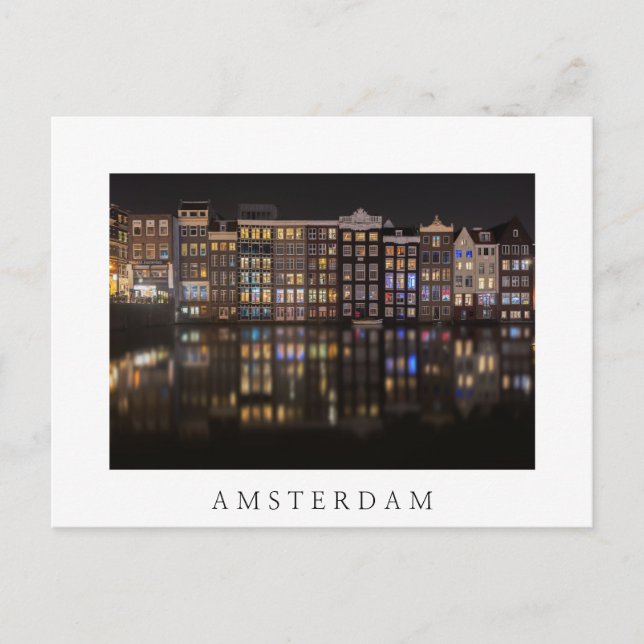 Amsterdamhus med färgad ljus på natten vykort (Framsida)