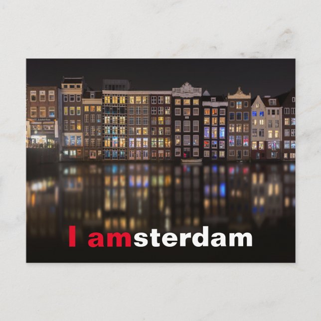Amsterdamhus med färgad ljus på natten vykort (Framsida)