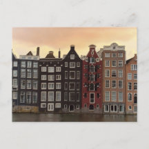 Amsterdamkanalhus vid solnedgång