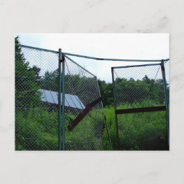 An abandoned house beyond the broken fence. vykort