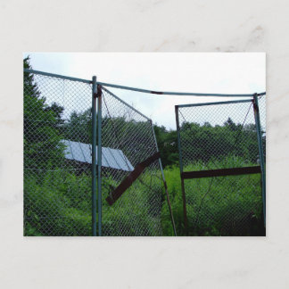 An abandoned house beyond the broken fence. vykort