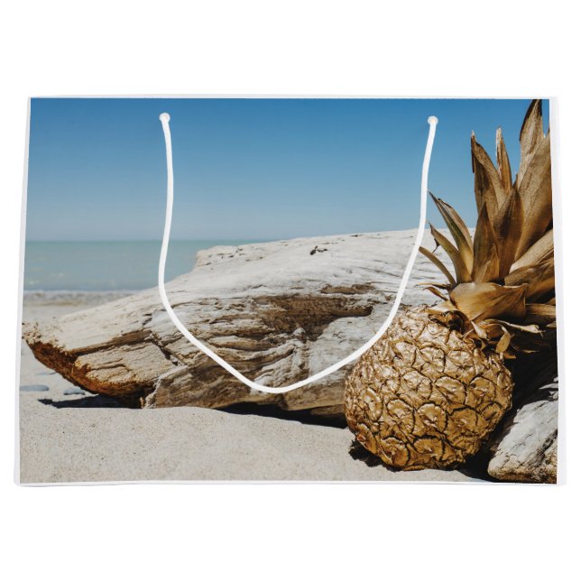 Ananas guld på stranden (Framsidan)