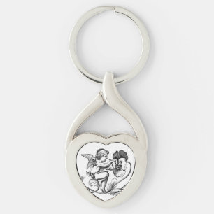 ANGEL PAINING FLOWER Metall Keychain Twisted Heart Silverfärgad Nyckelring