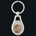 ANGEL SOM SPELAR LYRA ÖVER NORMÖRJA OVALT SILVERFÄRGAD NYCKELRING<br><div class="desc">Konstgjord och klassisk vattenfärgsmålning i vit sepia, brunt färg,  omformad från 1800-talets italienska bra art</div>