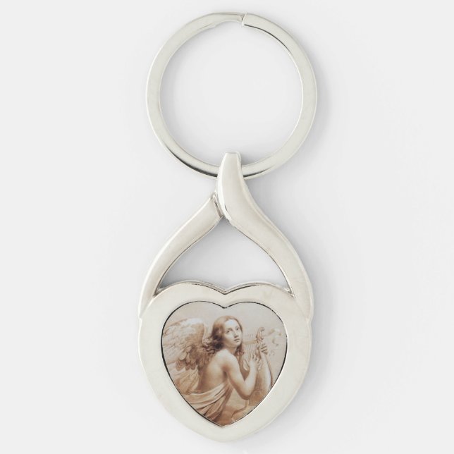 ANGEL SOM SPELAR LYRA ÖVER NORMÖRJA TWISTED HEART SILVERFÄRGAD NYCKELRING (Framsidan)