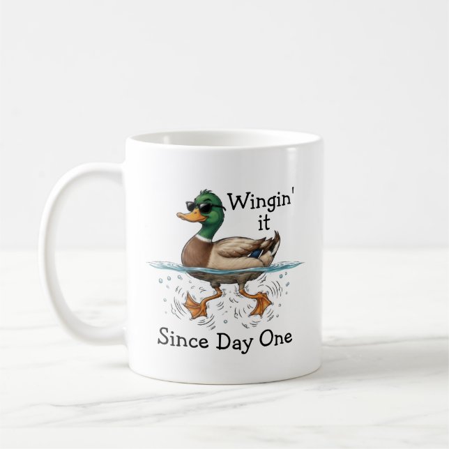 Anka som wingar det kaffemugg (Vänster)