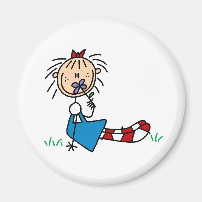 Annie Ljuger i gräs med blommiga magnet (Framsidan)