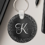 Anpassningsbar Black Glitter Gnistra Monogram Nyckelring<br><div class="desc">Anpassa enkelt den här eleganten för trendig-nyckelkedjan med söt svart mousserande glitter på en svart,  borstad metallisk bakgrund.</div>