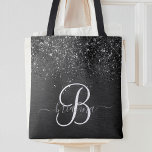Anpassningsbar Black Glitter Gnistra Monogram Tygkasse<br><div class="desc">Anpassa enkelt trendigets elegant till säcksdesignen med söt svart mousserande glitter på en svart,  borstad metallisk bakgrund.</div>
