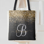 Anpassningsbar Glitter Black Gnistra Monogram Tygkasse<br><div class="desc">Anpassa enkelt trendigets elegant till säckens utformning med söt guld mousserande glitter på en svart,  borstad metallisk bakgrund.</div>