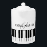 Anpassningsbarnas tekanna med svart och vitt stort<br><div class="desc">Anpassningsbar tekanna med svart och vitt stort piano-nycklar. Elegant monogram för namn eller citat av familjen. Unika presentidéer från födelsedagen för musiker,  pianospelare,  pianist,  vänner,  familj,  lärare,  medarbetare osv. Snyggt-manus-typografi.</div>