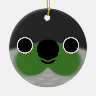 Ansikte i en parakit som kontrolleras av Grönten Julgransprydnad Keramik