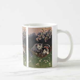 Antika djur, randig katt eller kattungar i en häng kaffemugg