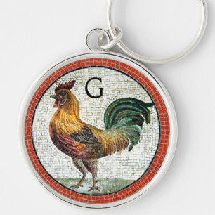 ANTIKA ROMERSKA MOSAIKER / TUPP MONOGRAM RUND SILVERFÄRGAD NYCKELRING