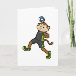 Apa på handbollsspelare med handboll kort