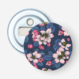 Äppelblommar på en mörk blått flasköppnare