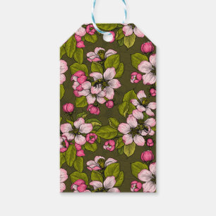 Äppelblommar på mörk grönt presentetikett