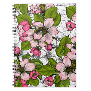 Äppelblommar på vitt anteckningsbok