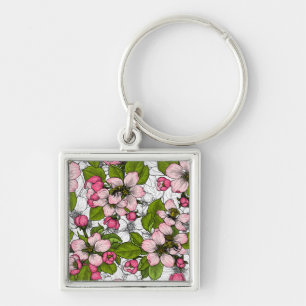 Äppelblommar på vitt fyrkantig silverfärgad nyckelring