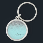 Aqua Blue Teal Silver Glitter Monogram Rund Silverfärgad Nyckelring<br><div class="desc">Aqua Blue - Teal and Silver Gnistra Glitter Script Monogram Namn nyckelringar (Nyckelring). Det gör perfekten söt 16-årsjubileum,  bröllop,  möhippa,  årsdag,  babydusch eller bachelorette-fest för någon som glam lyxen och chic stilar i kärlek.</div>